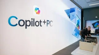 An attendee in the demo space for the Copilot+PC at the Microsoft campus in Redmond, Washington, US, on Monday, May 20, 2024. Microsoft Corp. chief executive officer Satya Nadella is betting a new generation of computers with specialized artificial intelligence chips and faster performance will revive the long-running rivalry between Windows PCs and Apple Inc.'s Mac. Photographer: Chona Kasinger/Bloomberg© 2024 BLOOMBERG FINANCE LP